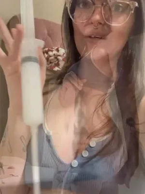 This bespectacled bitch’s syringe teases, ‘Unzip that cock. Welcome to euphoria.’