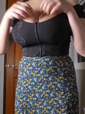Petite vixen in chic black top and floral skirt, her pussy aching for a wild fucking.