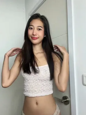 Sultry Asian vixen teasing, her white stockings making cocks stand to attention.