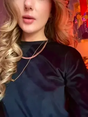 Tickling her fuckin’ blonde locks while she strikes a pose that makes your cock throb.