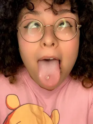 Your naughty nerd is teasing with her tantalizing tongue in an Ahegao pose. Let's steam things up, shall we? 😉