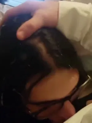 Spit in her face while she gags on your cock