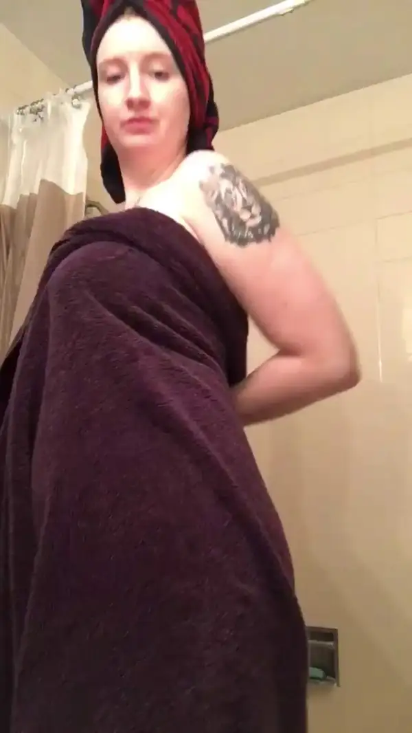 Spotted this badass tattooed chick soaking wet in the shower all  